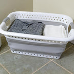 Camco Collapsible Laundry Basket, Large, White/Gray - Pop Open Waterproof Plastic Bin with Handles for Home, Dorm, RV Storage | 18 x 24 in, collapses to 3.2 in tall, expands to 10.5 in, white and gray plastic for home, dorm and RV storage